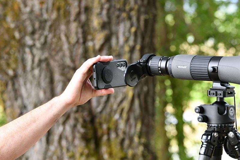 Positioning a cell phone on a spotting scope using the S1 phone adapter mount from MAGVIEW. 