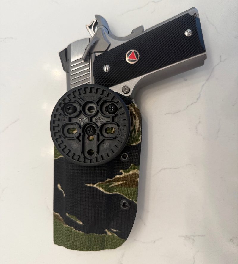 Reverse side of a QD holster using BladeTech and DIY camo holster wraps. This one is in tiger strip pattern cordura. 