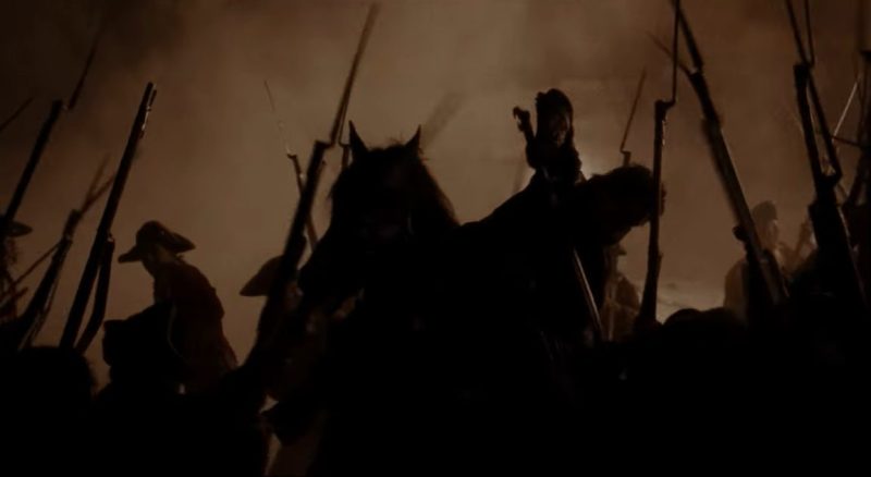charleville muskets and brown bess muskets with bayonets surround the Hessian during the Revolutionary battle flashback