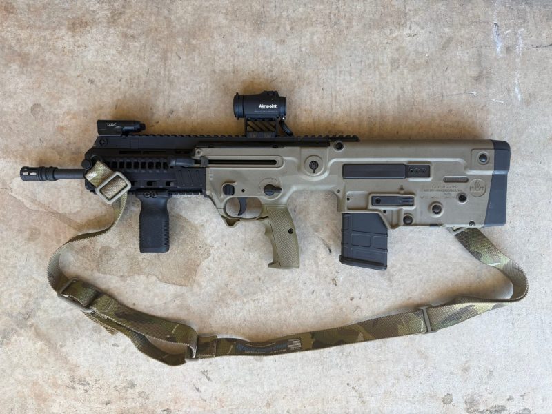 Tavor X95 with military pistol grip replacing the civilian cutlass grip.