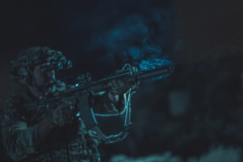 Silencer smoking during a night shoot. 