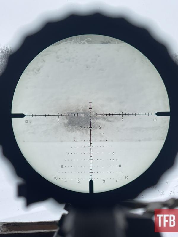 Schmidt & Bender’s new SBX reticle for the 3-18x42 META is excellent for hunting and DMR/PRS style shooting. However, when it’s snowing heavily no optic will help. Here’s looking at three 20/30cm steel in a wooden box at 310 meters.