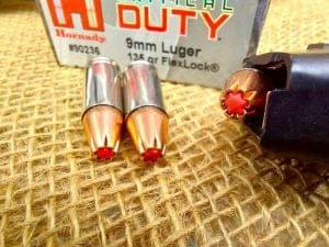 Hornady Critical Duty 9mm on table and in magazine
