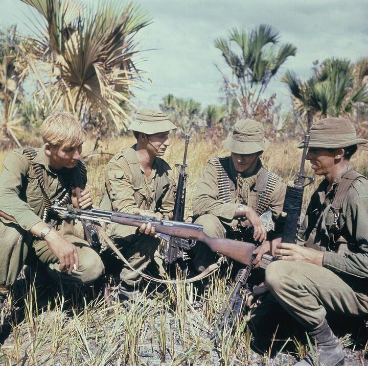 fudd friday why you want an sks for hunting and why you don t, Australian soldiers look at a captured SKS during the Vietnam War After the Cold War ended the American market was flooded with surplus SKS rifles from China and Europe