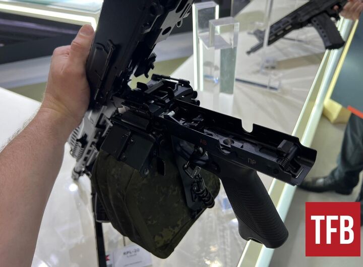 inside russia s rpl 20 machine gun, Open feed tray cover of the bottom feeder By Lynndon Schooler
